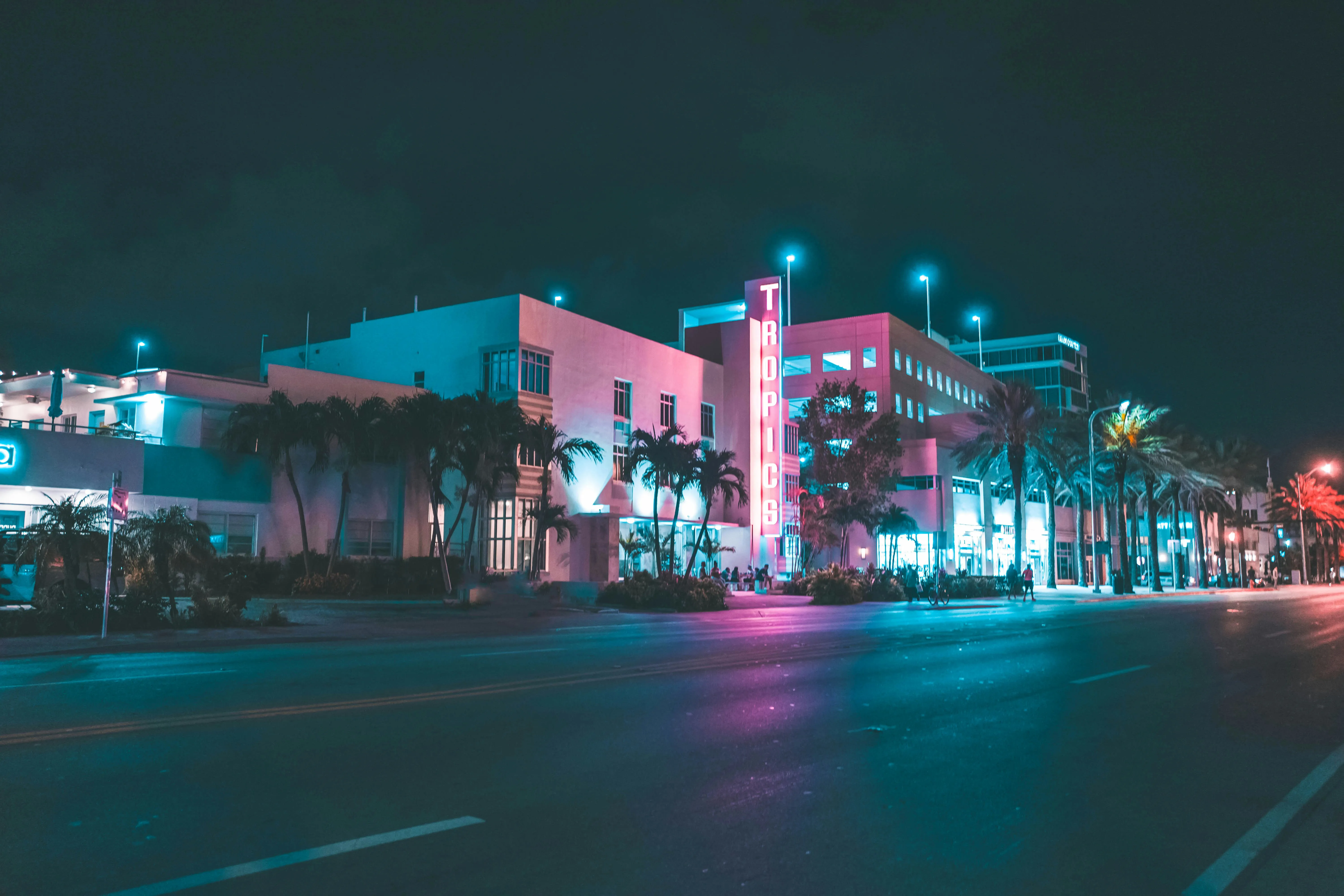 Neon-lit Ocean Drive in Miami at dusk — the real Vice City